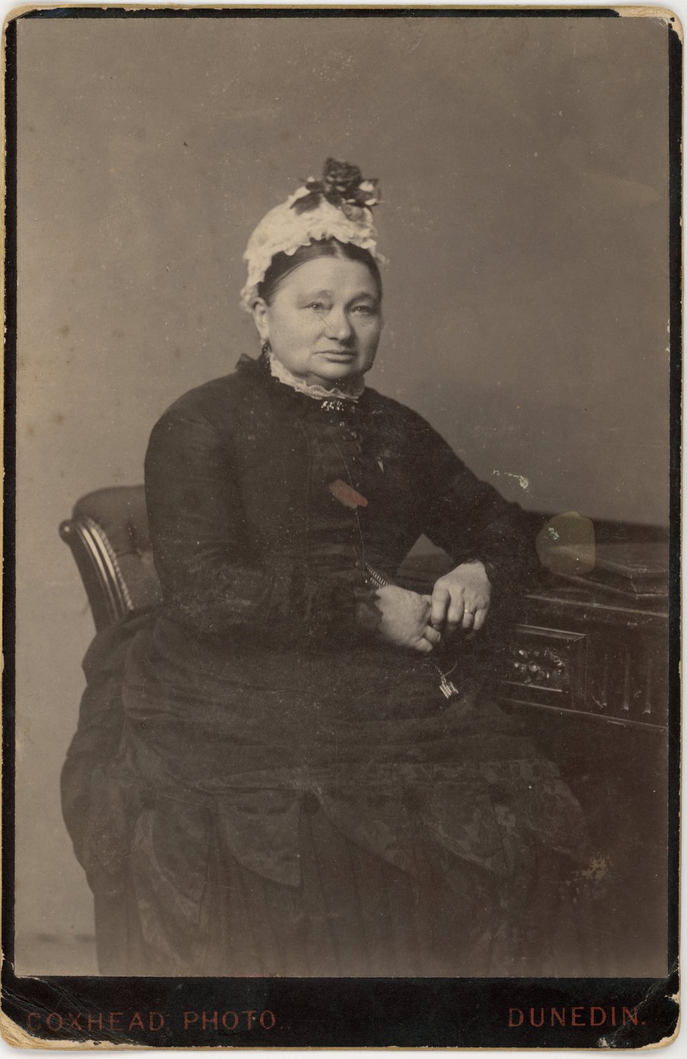 Studio portrait of mature lady.