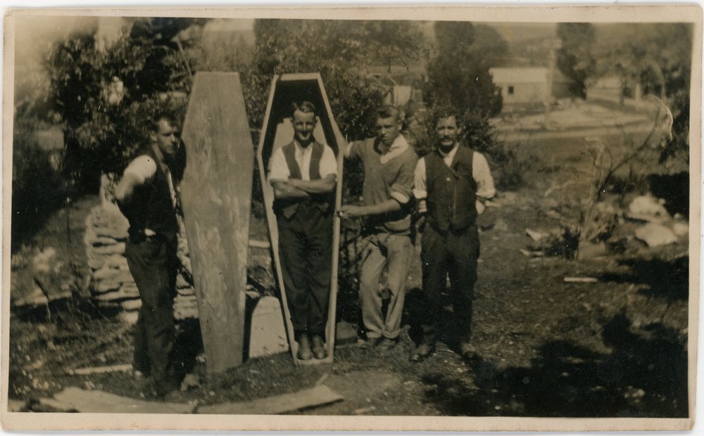 Tree planters at Waipori try out a coffin for size