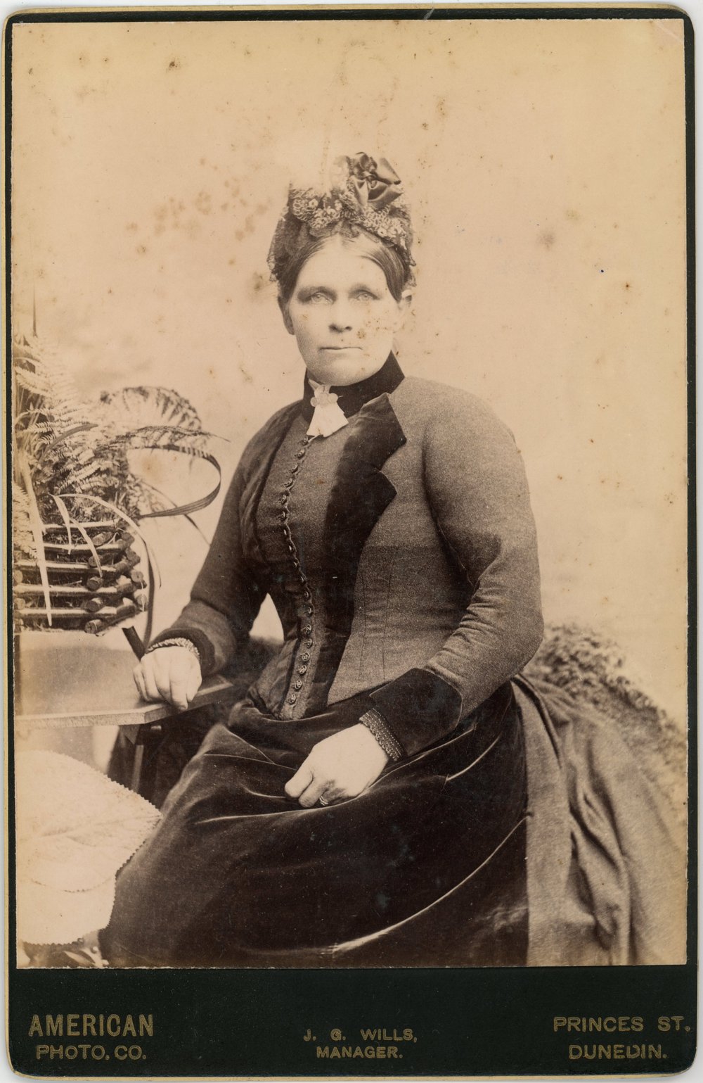 Studio portrait of a married lady in formal dress.