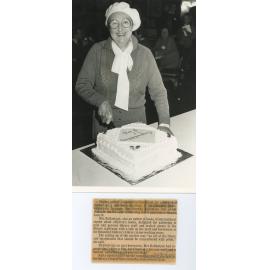 Mrs Dorothy Ballantyne cuts the cake for the Children's Library 75th Celebrations