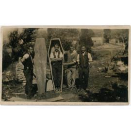 Tree planters at Waipori try out a coffin for size