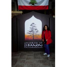 Suzanne Kallil at entrance of Children of Lebanon exhibition held at the Museum of Otago.
