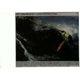  An award  winning photo of Seth McPhee diving into a huge surf.