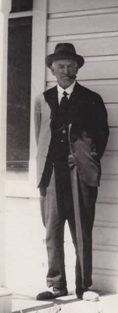 George Firman photo taken outside Engineer's house at Waipori Falls late 1930's